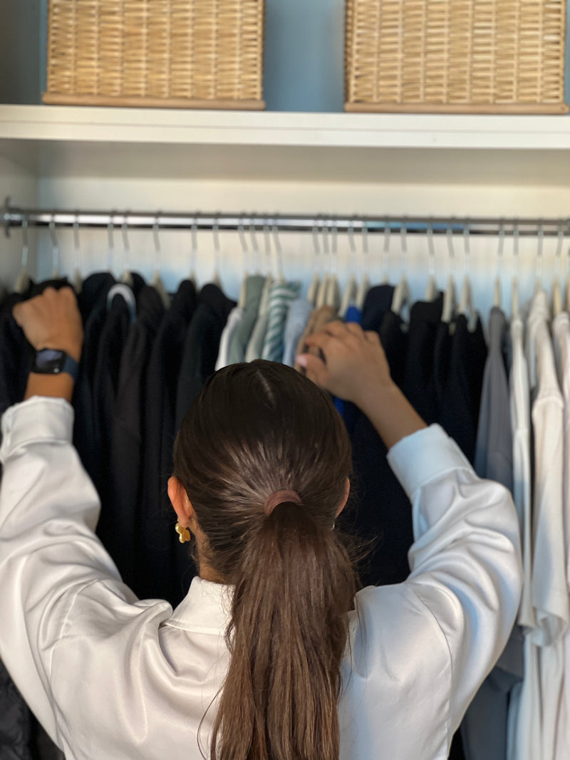 Casa Eva team organizing and unpacking a wadrobe during a move-in | Dubai, United Arab Emirates